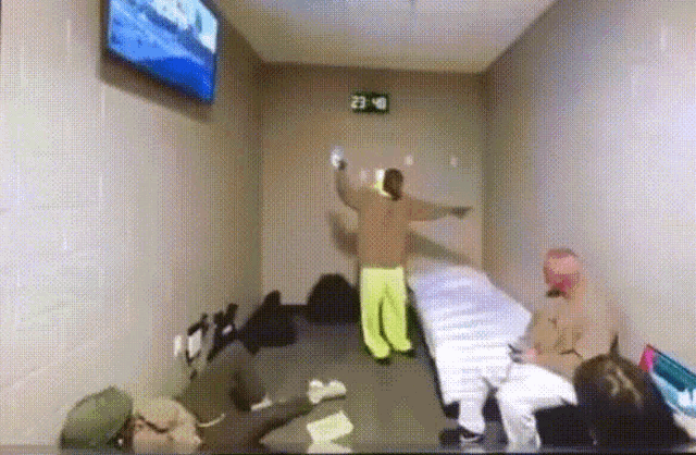 a room with a clock on the wall that reads 21:40