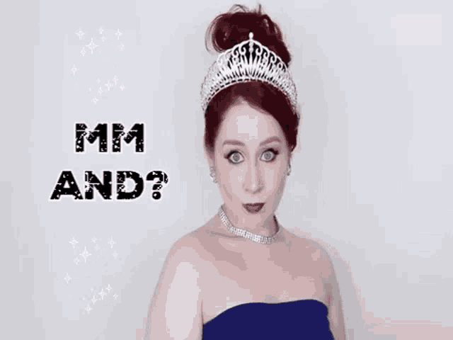 a woman wearing a tiara and a blue dress says mm and