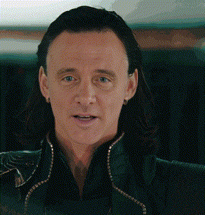 a close up of a man 's face with long hair and a green jacket .