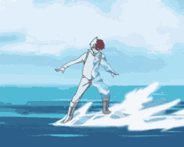 a man in a white suit is riding a wave in the ocean ..