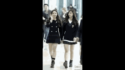 a blurry picture of a group of people walking