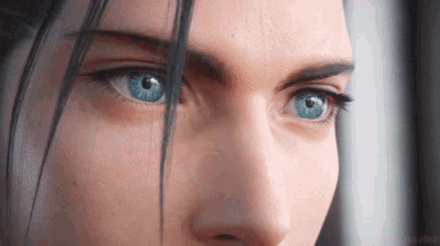 a close up of a woman 's face with blue eyes and a watermark that says ' gdcmoviez '