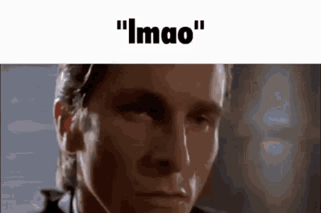 a close up of a man 's face with the words `` lmao '' written above it .