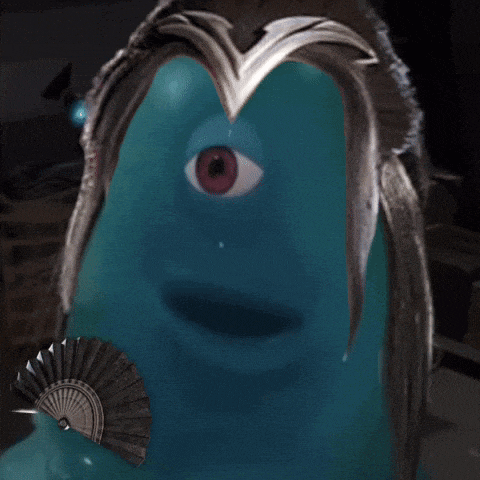 a blue monster with a fan in front of it