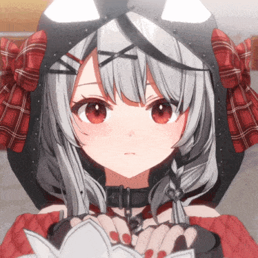 a girl with gray hair and red eyes is wearing a black and red hoodie
