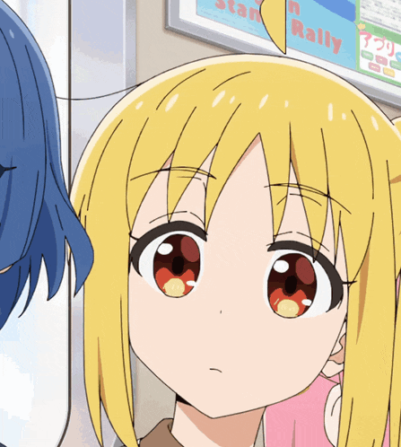 a close up of a girl 's face with a sign in the background that says ' n rally '