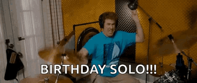 a man in a blue shirt is playing drums with the words birthday solo written below him