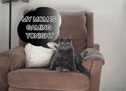 a cat is sitting in a chair with a speech bubble that says my mom is gaming tonight
