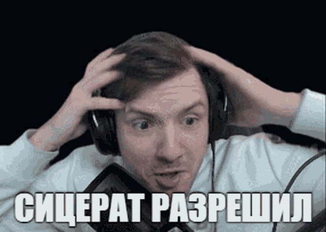 a man wearing headphones is making a funny face and has the word " sniperat " on the bottom