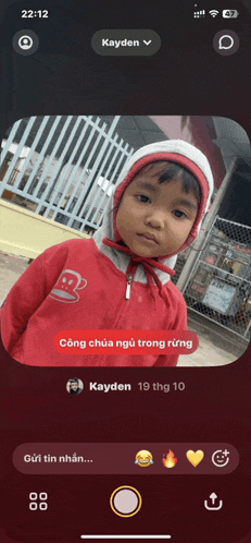a phone screen shows a picture of a little girl and says kayden in the upper right corner