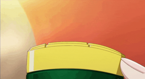a person is holding a yellow and green object