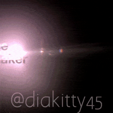 a black background with a light coming out of it and the name diakitty45 on it