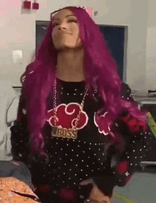 a woman with purple hair and a necklace that says boss on it