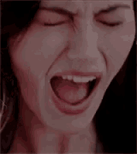 a close up of a woman 's face with a red background