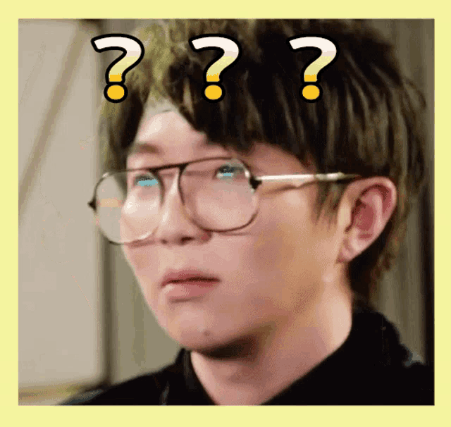 a man wearing glasses has a question mark on his forehead