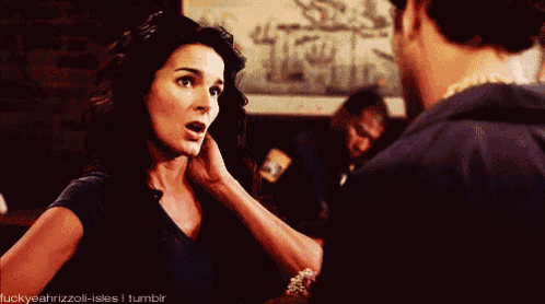 a gif of a woman touching a man 's ear with the caption luckyyeahrizzoli-isles i tumblr