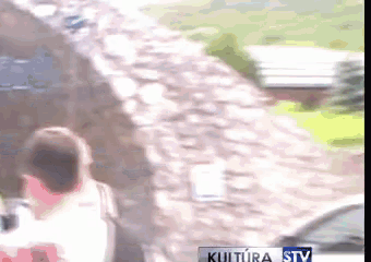 a blurred image of a stone wall with the words kultura stv on the bottom