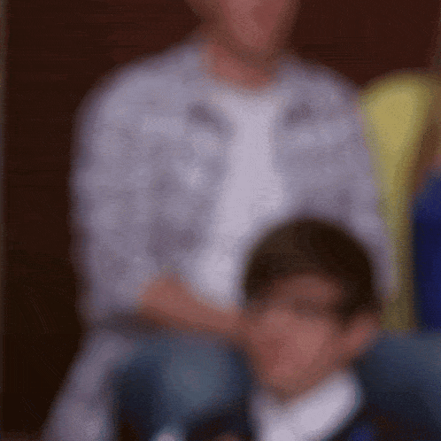 a blurry picture of a man and a boy