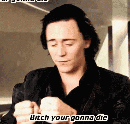 a man in a black jacket is making a funny face and says bitch your gonna die .