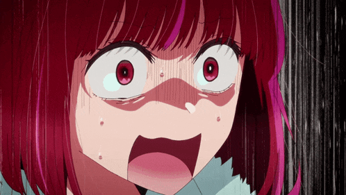 a close up of a girl 's face with red hair