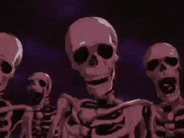 a group of skeletons are standing next to each other and smiling .
