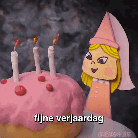 a paper doll is standing next to a birthday cake that says fijne verjaardag