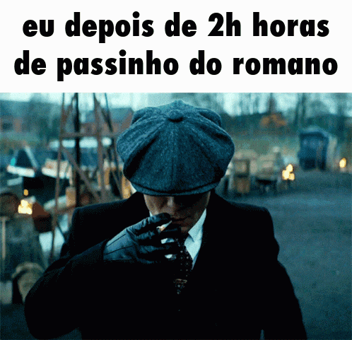 a man in a suit and hat is smoking a cigarette with the words eu depois de 2h horas de passinho do romano below him