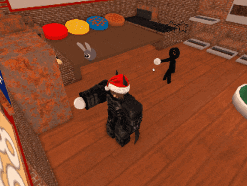 a person in a santa hat is standing in a room