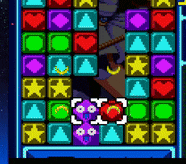 a colorful puzzle game with a purple owl in the middle