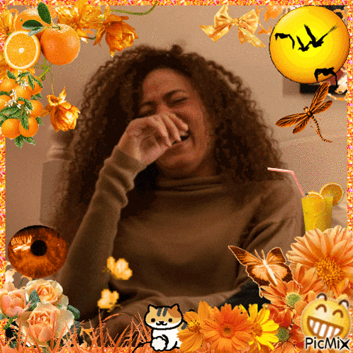 a picture of a woman laughing surrounded by orange flowers and butterflies