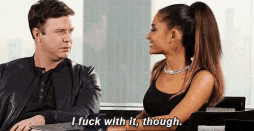 a man and woman are sitting at a table and the woman is saying i fuck with it though