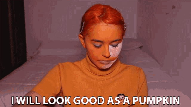 a woman with orange paint on her face has the words i will look good as a pumpkin below her