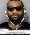 a man with a beard and sunglasses is wearing headphones and sunglasses .