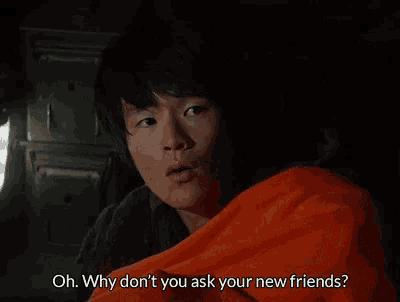 a man is wrapped in an orange blanket and says oh why don t you ask your new friends