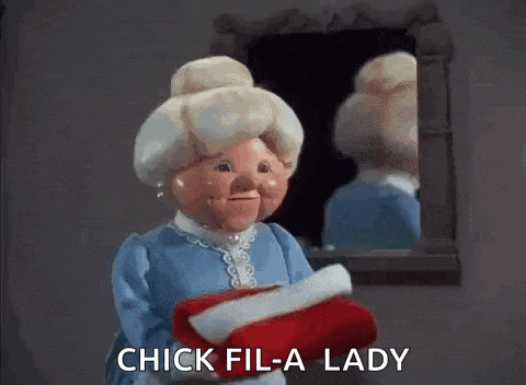 a cartoon character is holding a red glove and saying chick fil-a lady .