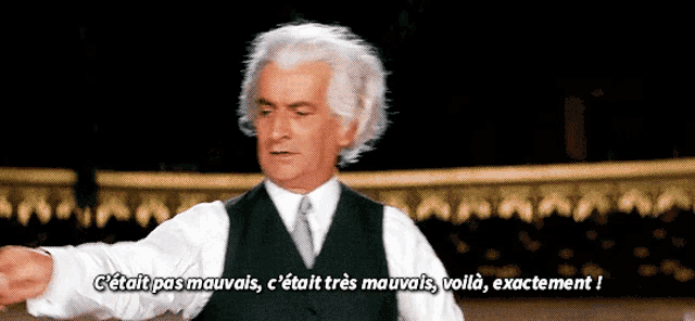 a man in a suit and tie says " c'était pas mauvais c'était très mauvais "