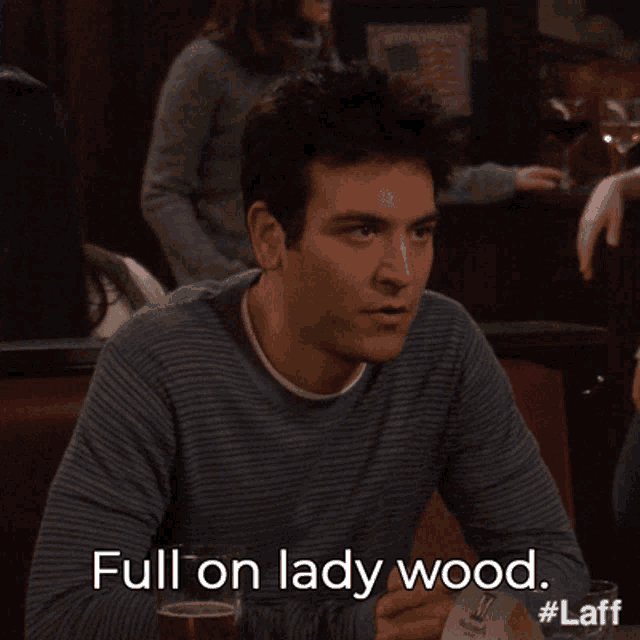 a man sitting at a table with the words full on lady wood written on the bottom