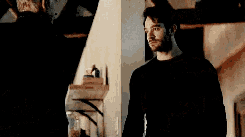a blurry picture of a man in a black shirt