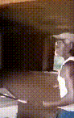 a blurred image of a man wearing a hat