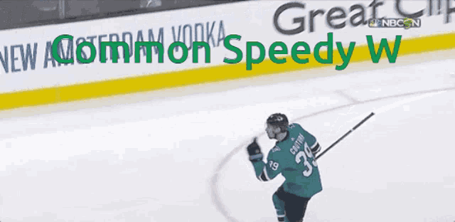 a hockey player in front of a sign that says " great speedy w "