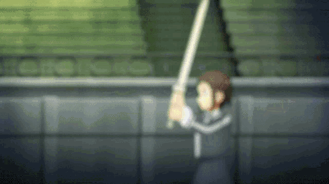 a person is holding a sword in a stadium .