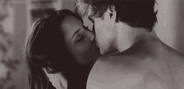 a man and a woman are kissing in a black and white photo with the caption withfulshipping