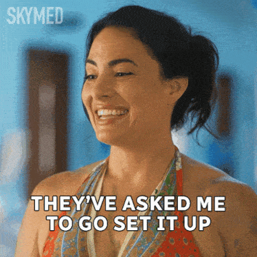 a woman in a bikini is smiling and saying they 've asked me to go set it up