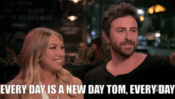 a man and a woman are sitting next to each other with the caption every day is a new day tom every day