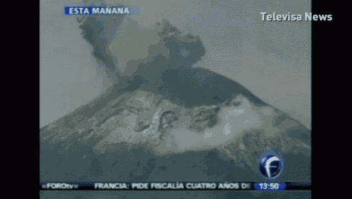 a television screen shows a volcano erupting and says televisa news at the top