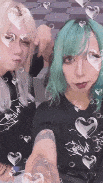 a girl with green hair is wearing a black shirt that says " a.m. "