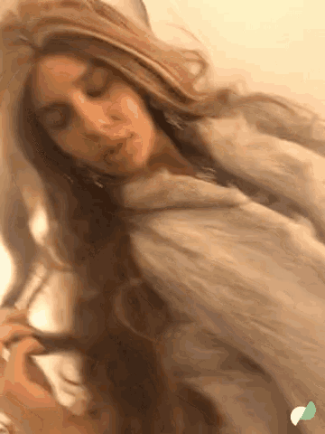 a close up of a woman with long hair