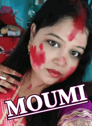 a woman with red paint on her face has the name mouni on the bottom right