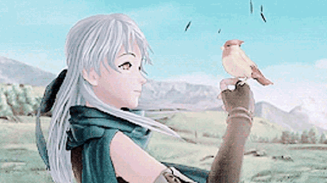 a girl is holding a small bird on her finger .