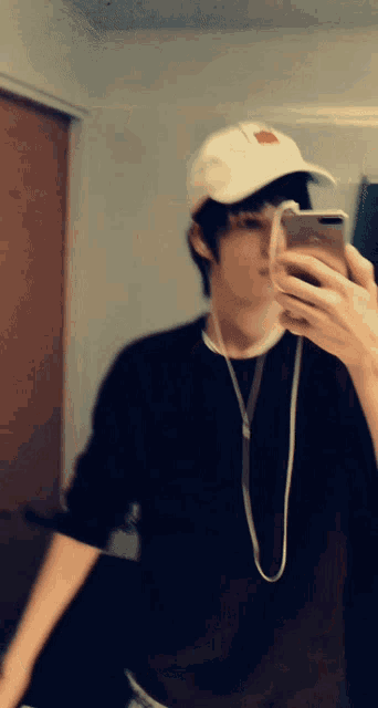 a person taking a picture of themselves with a phone